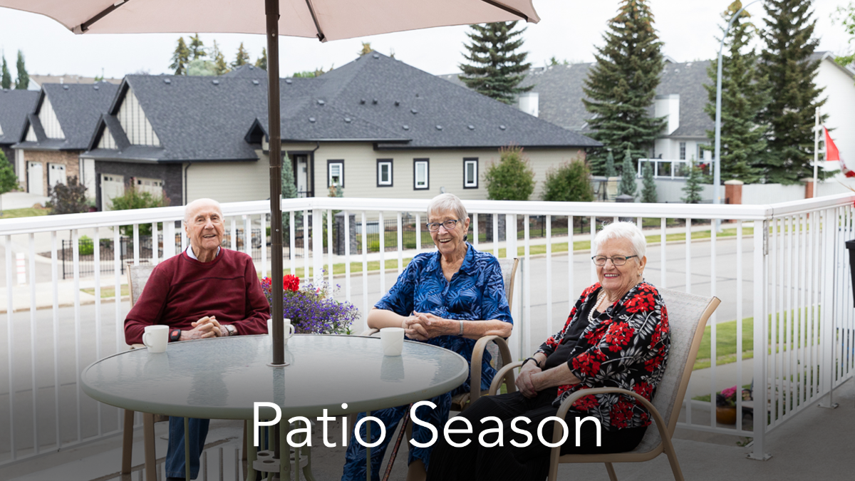 Three seniors sitting on a patio together