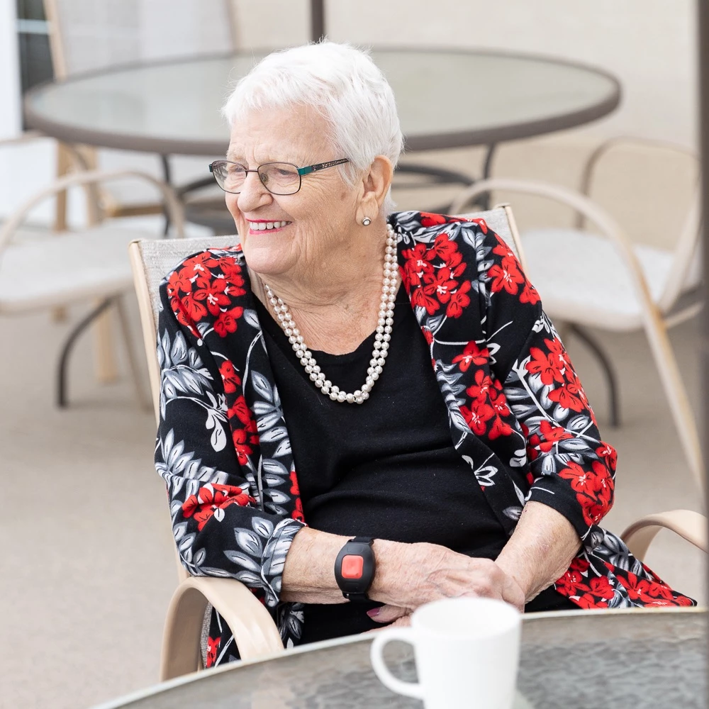 Senior woman enjoying tea on patio
