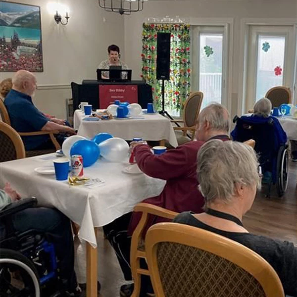 Seniors seated and enjoying a speaker sharing
